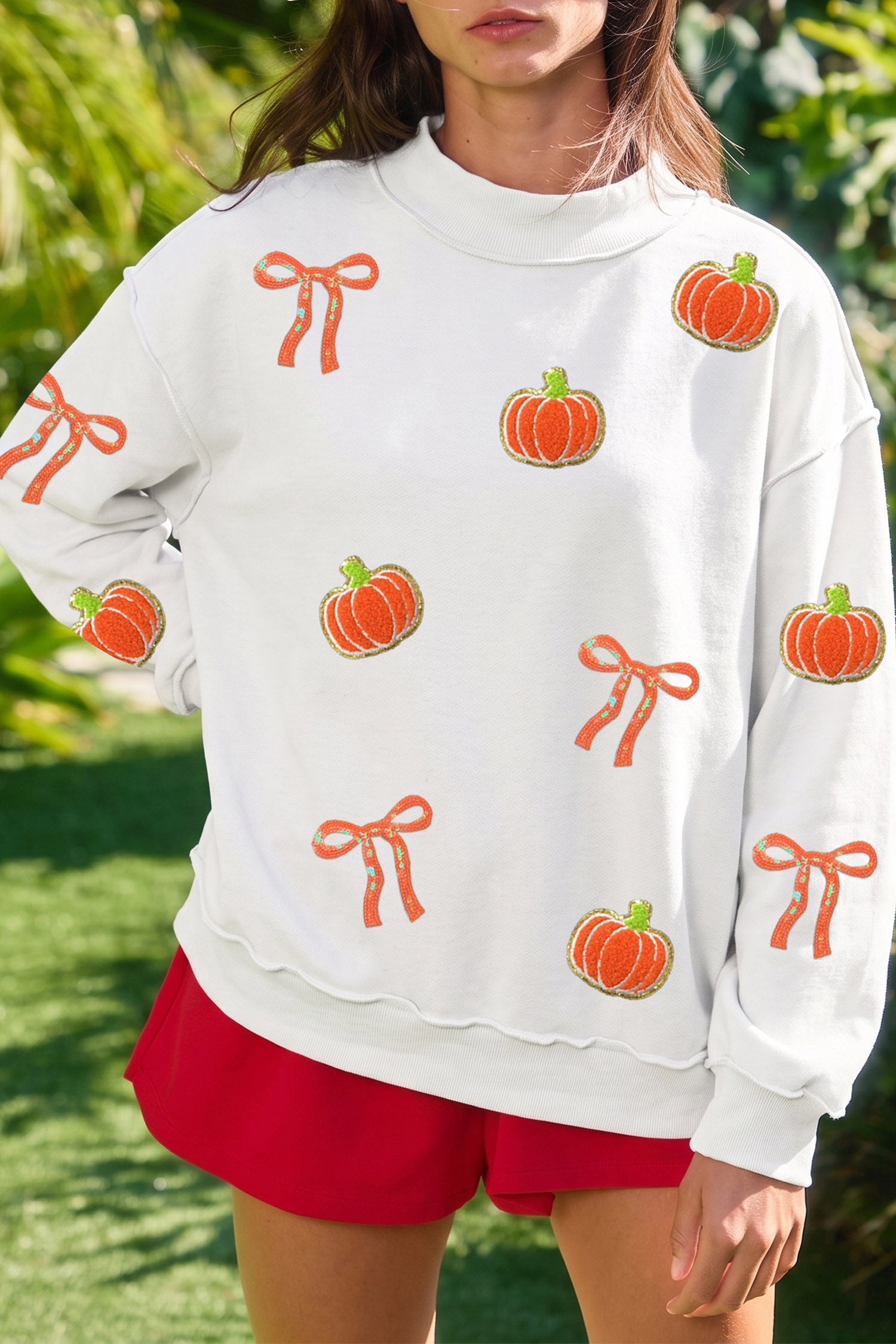 White Chenille Pumpkin Sequin Bow Graphic Exposed Seam Mock Neck Sweatshirt