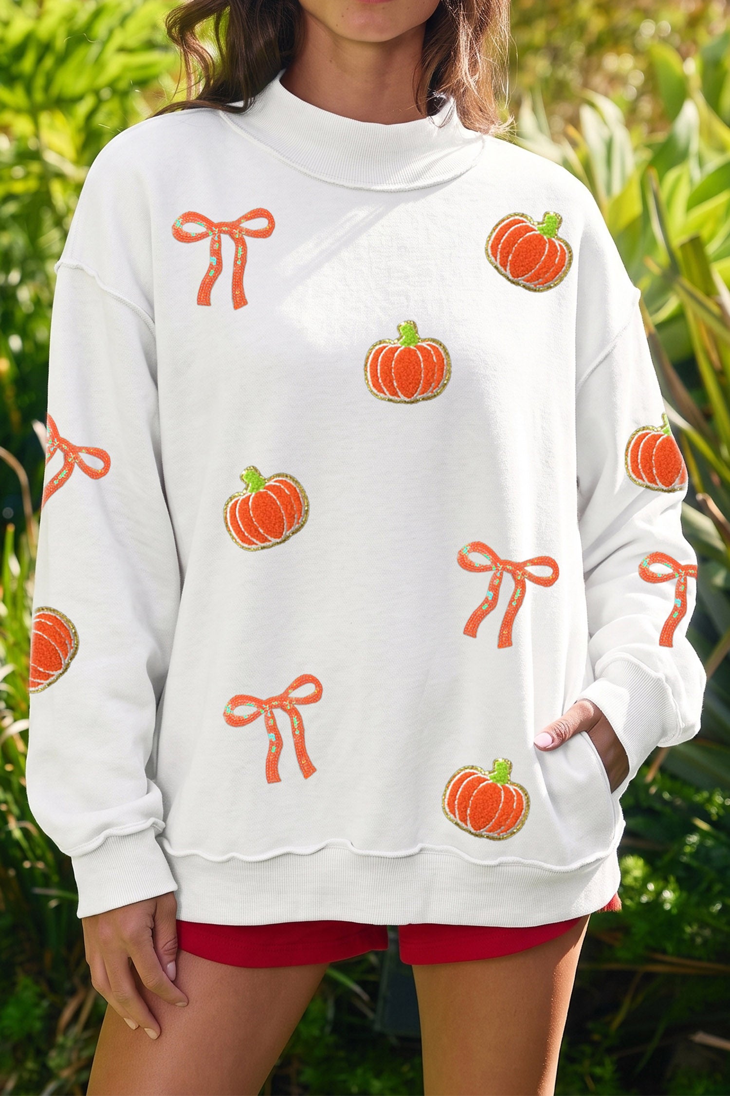 White Chenille Pumpkin Sequin Bow Graphic Exposed Seam Mock Neck Sweatshirt