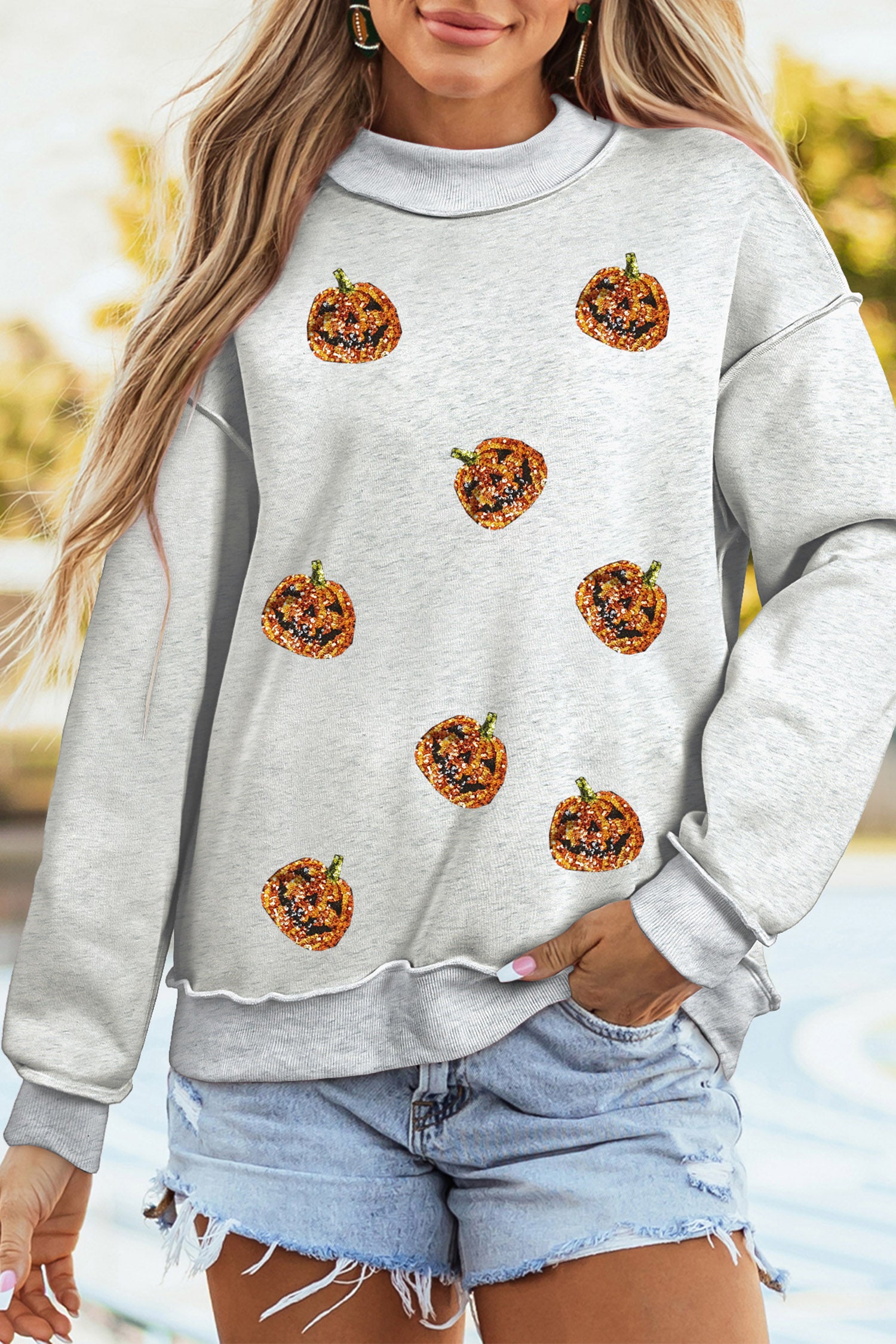 Light Grey Sequined Halloween Pumpkin Graphic Exposed Seam Mock Neck Sweatshirt