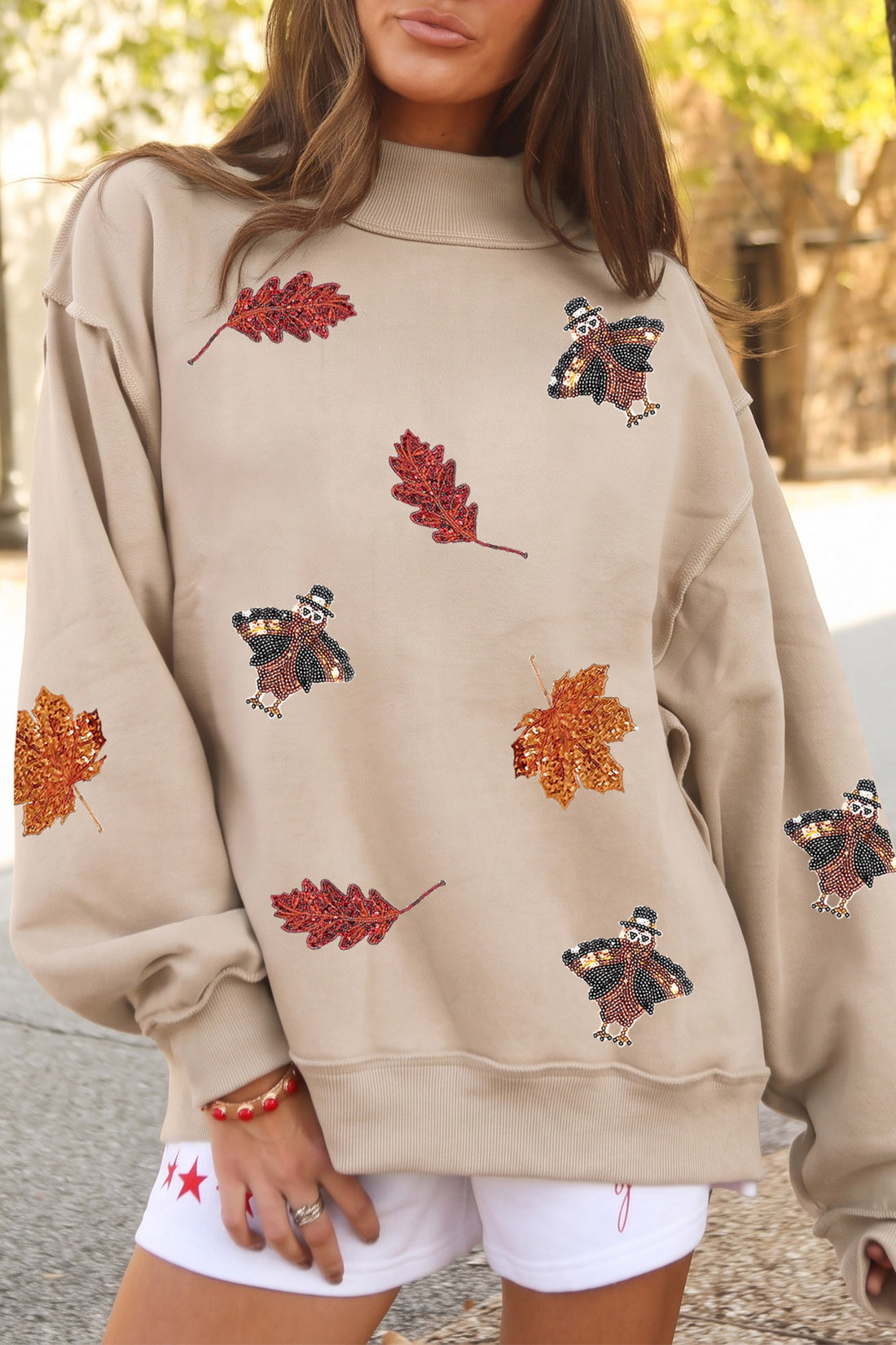 Apricot Sequin Turkey Leaf Graphic Exposed Seam Mock Neck Sweatshirt