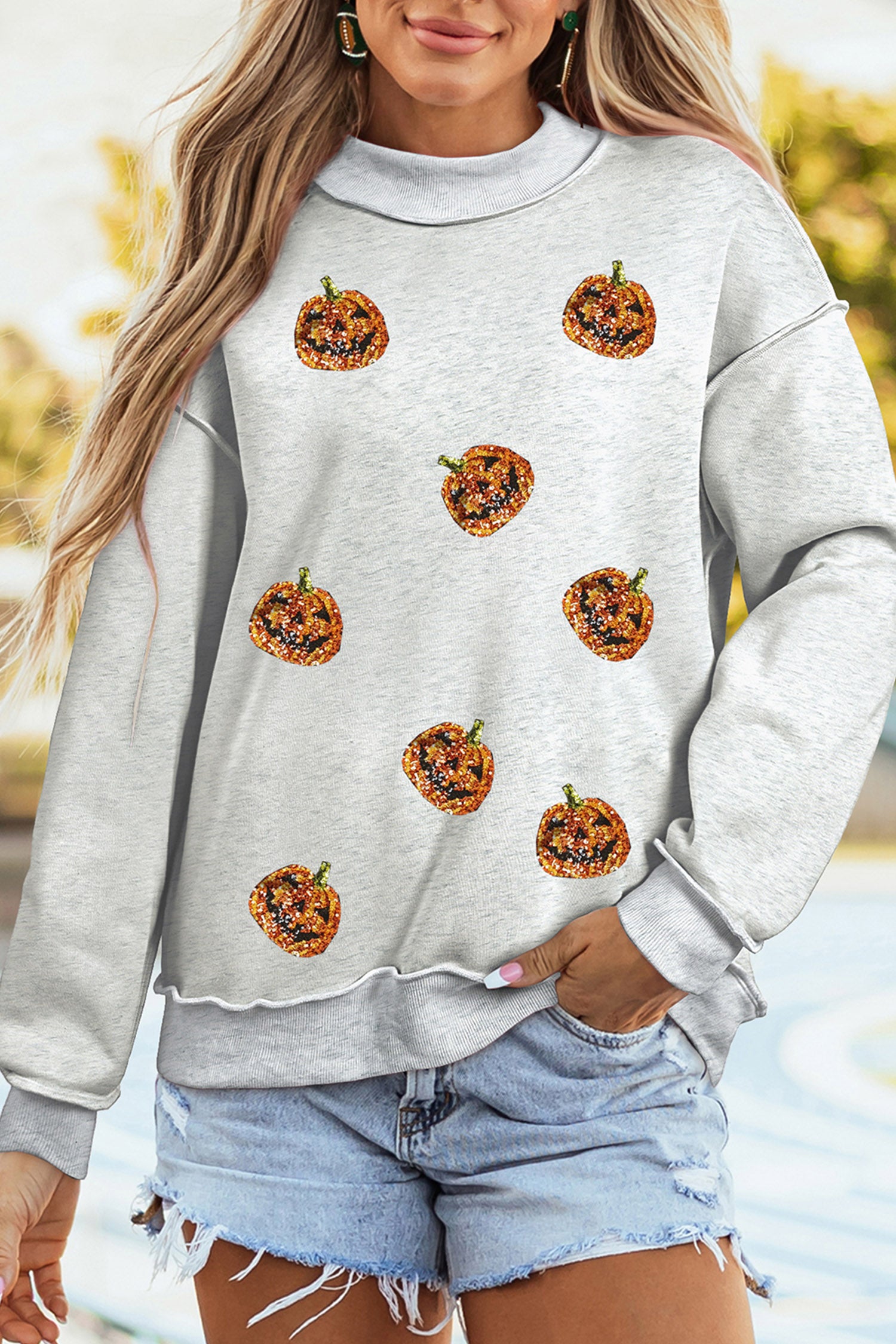 Light Grey Sequined Halloween Pumpkin Graphic Exposed Seam Mock Neck Sweatshirt