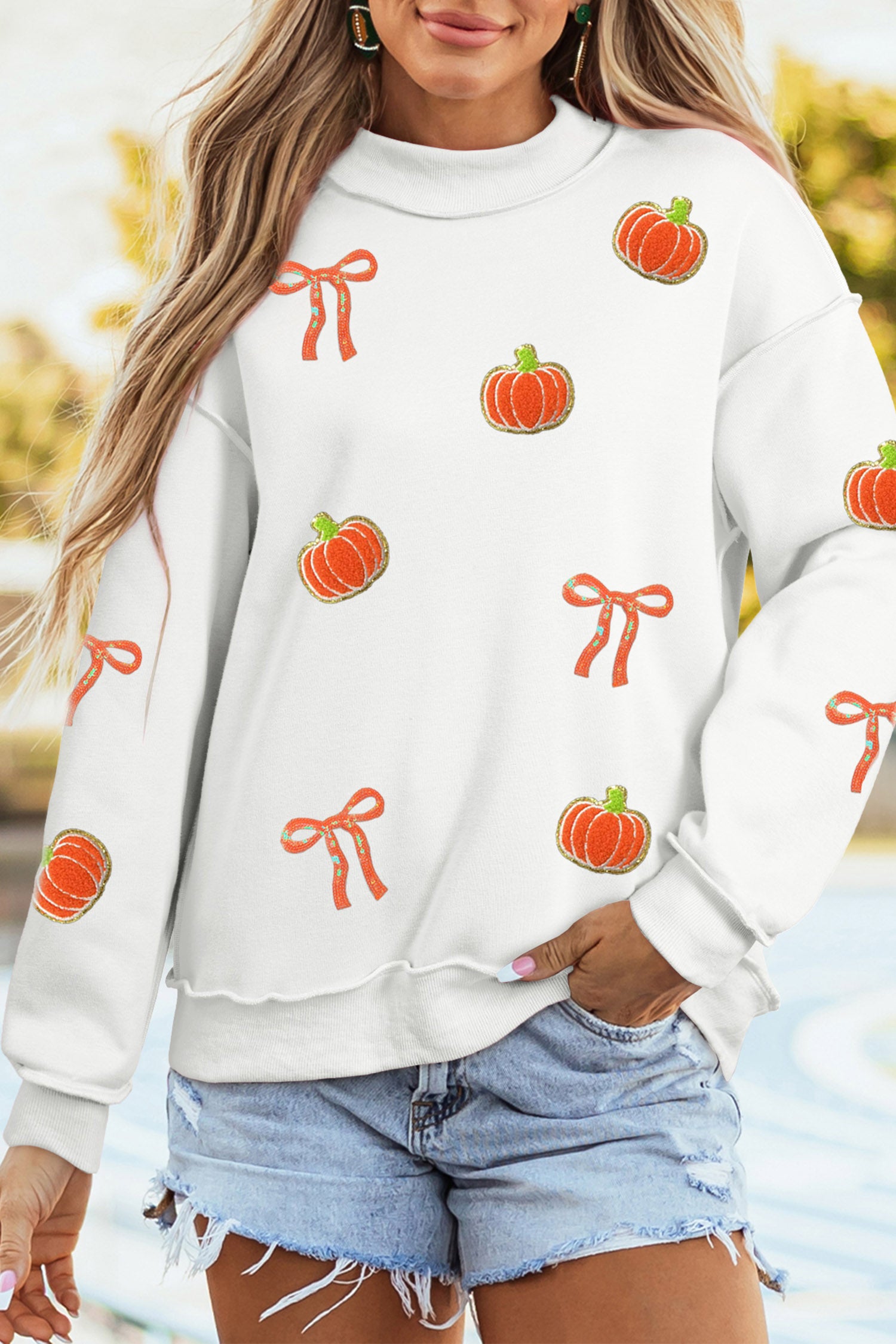 White Chenille Pumpkin Sequin Bow Graphic Exposed Seam Mock Neck Sweatshirt