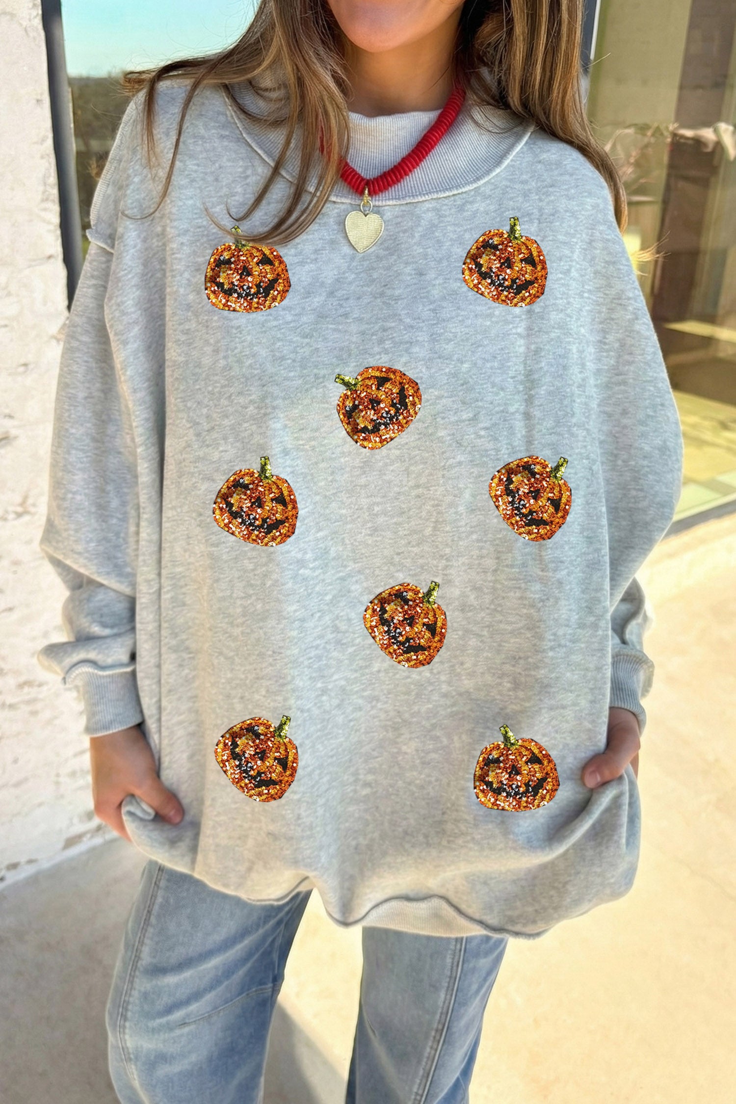 Light Grey Sequined Halloween Pumpkin Graphic Exposed Seam Mock Neck Sweatshirt