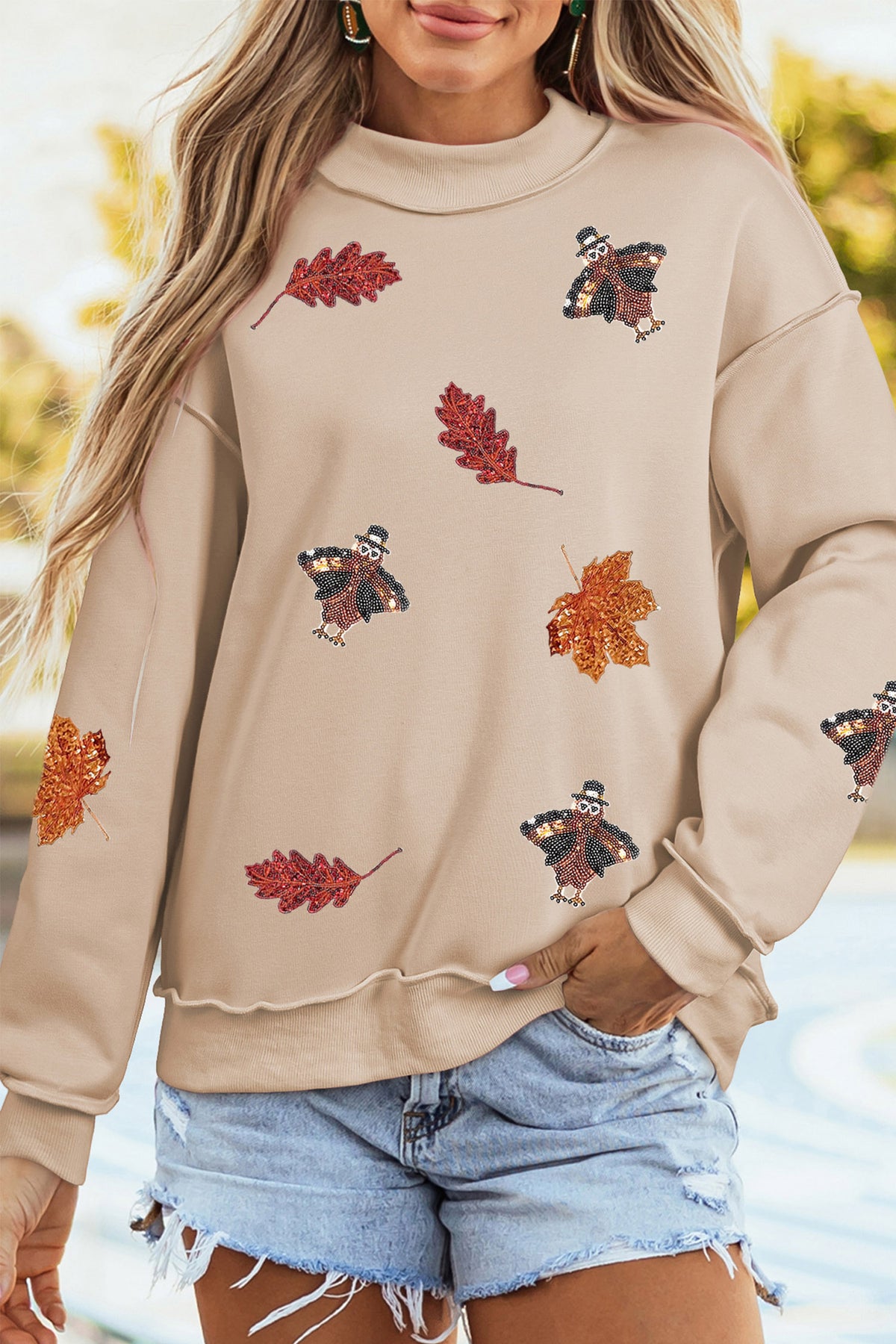 Apricot Sequin Turkey Leaf Graphic Exposed Seam Mock Neck Sweatshirt