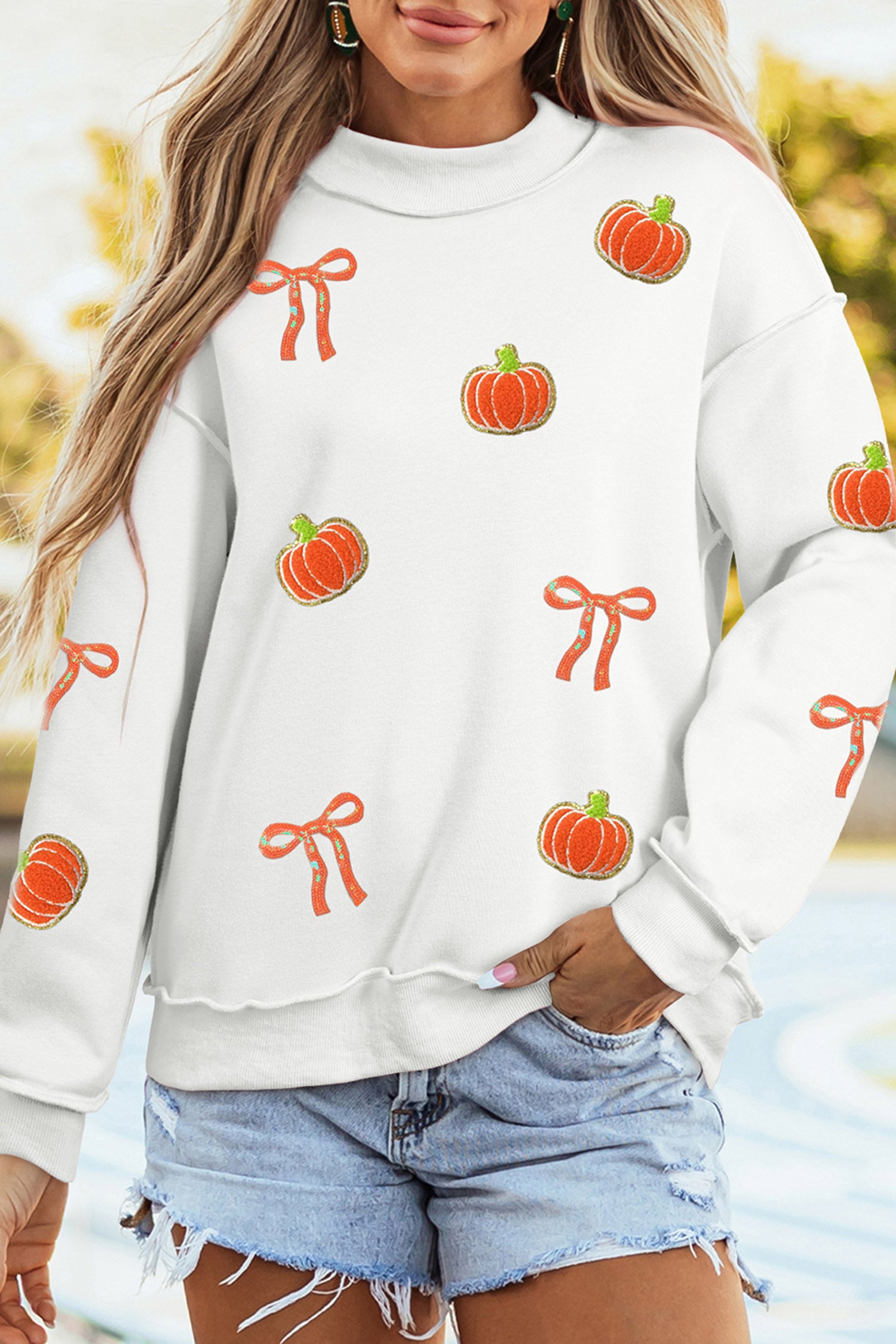 White Chenille Pumpkin Sequin Bow Graphic Exposed Seam Mock Neck Sweatshirt