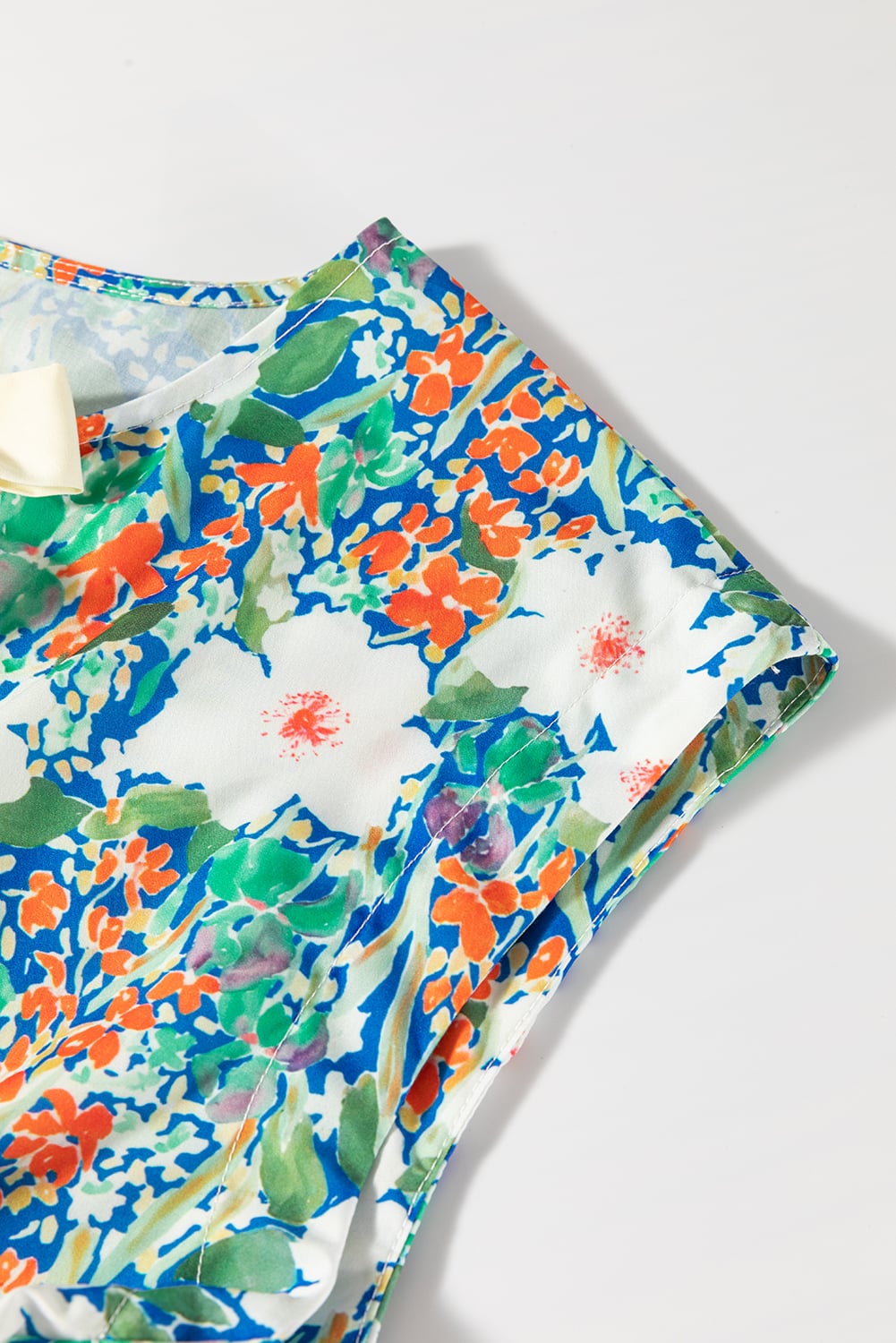 Green Floral Print Bow Applique Slit Sleeveless Peplum Blouse