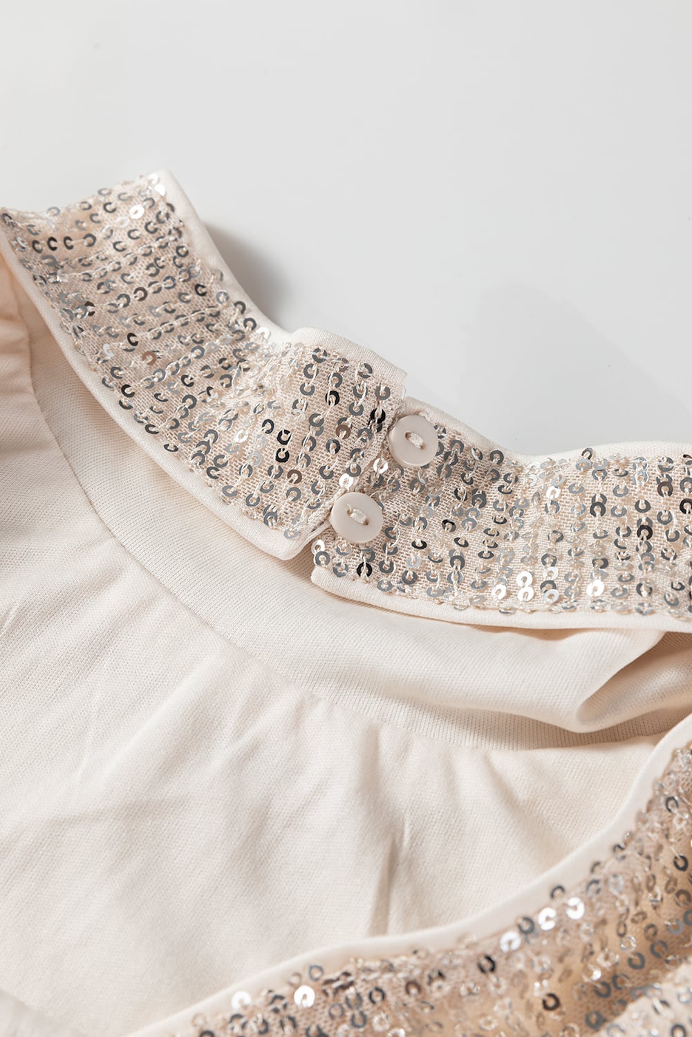 Jet Stream Sequin Mock Neck Drape Open Back Bell Sleeve Top